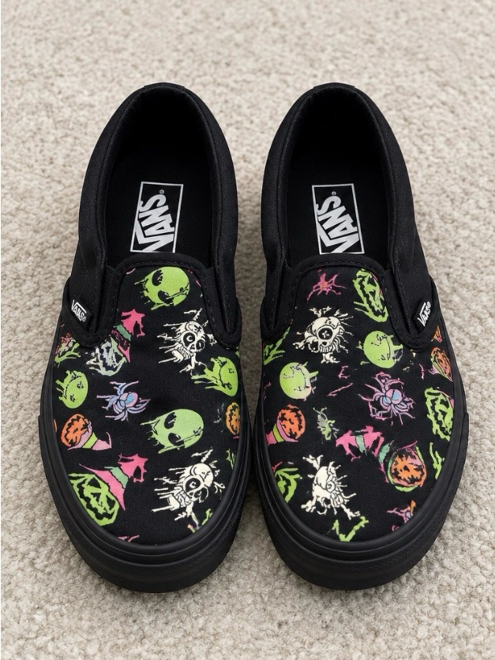 Vans Kids Black Slip-On with Neon Green Pink Orange and Purple Halloween Print